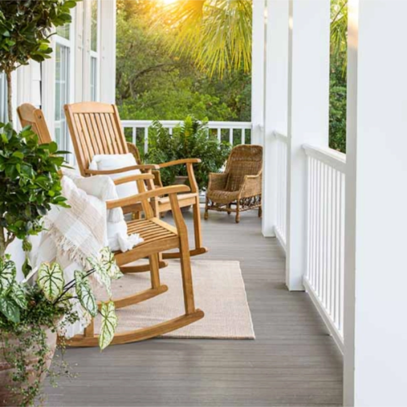 perspective-view-of-the-front-white-porch-with-wooden-rocking-chairs-and-potted-plants-in-twin-cities-mn